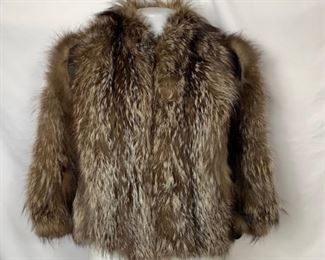 Short Fur Coat with silk lining. Shoulder to Shoulder 16 inches. Shoulder to hem 22 inches. Sleeves 19 inches. Chest 38 inches. $60 shipping included.