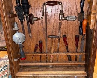Vintage Tools stored  in a custom sliding Tambour door cabinet 