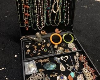 Wide selection of vintage necklaces, brooches, victorian era jewelry, belt buckles, rings, sterling silver, pendants, vintage pipes, bakelite bracelets. Jewelry