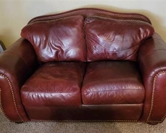 Red Oxblood Leather Robinson and Robinson Loveseat 69" x 39" x 37" in Basement