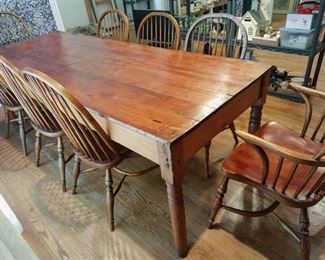 Civil War era solid wood dining table 30 x 96 x 36 in with 6 spindle back oak and 2 spindle back armed dining chairs