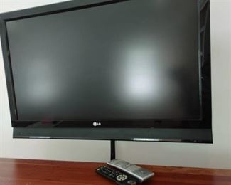 LG 45 in t.v. with 2 remotes (will need to be removed from wall)
