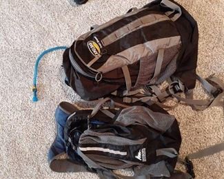 2 Hikers backpacks. One has hose for drinks