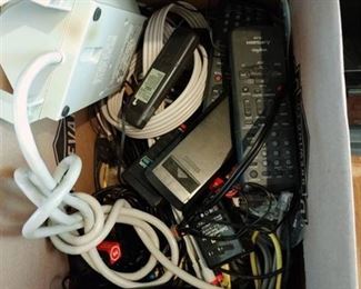 Assorted cords and power strips and remotes
