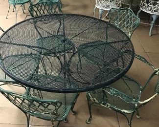 Woodard Set, 4-5 Chairs in chippy green vintage finish.