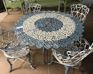 Cast Iron Scallop Table and 4 sweetheart chairs .
