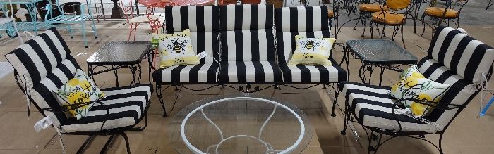 Set is coach, chair, bouncy rocker chair, 2 end tables, and cushions. Make your patio a show place.