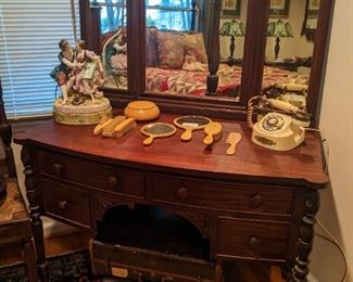 1920's 4-drawer mahogany desk, with triple mirror, vintage European Countess desk telephone, 8-piece Bakelite vanity set, amazing porcelain figurine 2-light table lamp and vintage suitcases.