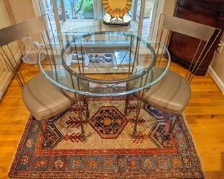 Cute little wrought iron breakfast table, with ogee edge glass top and pair of matching chairs atop a hand-woven Persian Malayer rug, measuring 3'3" x 5' 6".