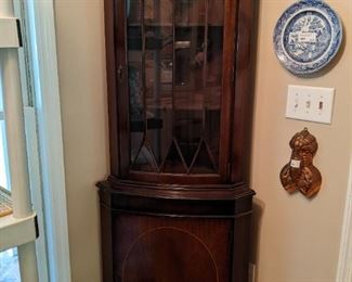 Vintage mahogany corner cabinet, with string inlay and glass mullion doors.