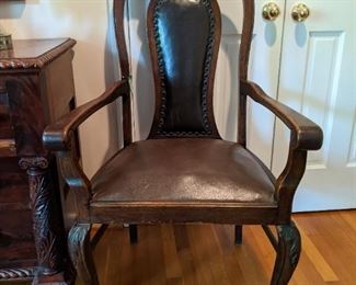 Smart and reasonable carved mahogany/leather armchair.