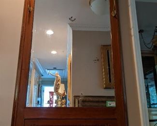 68" tall antique French inlaid walnut beveled glass wall mirror, with bronze mounts and coat hooks.