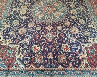 Finely detailed hand-woven Persian Isfahan rug, measures 9' 11" x 13' 8".