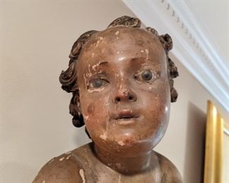 Great face on the 18th C. baby, with glass eyes.