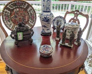 Close-up of the items on the convertible mahogany drum table.