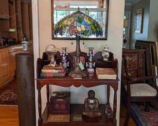 Nice vintage mahogany dry sink with two drawers and matching wall mirror, with beveled glass. There's also a very nice Tiffany style stained glass table lamp with heavy metal base, vintage books, mud man Asian figurine, pair of Asian porcelain candlesticks, gold gilt buddha and complete 1920's Asian mahjong set - detailed pics to follow of the set.