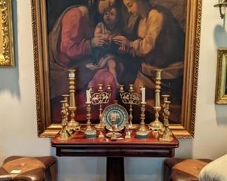 17th century oil on board copy of Antonio da Correggio's "The Mystic Marriage of Saint Catherine", Empire mahogany game table, w/Collection of English brass candlesticks, Mottahedeh porcelains and matching pair of vintage leather ottomans.