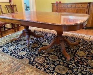 Widdicomb Georgian-style banded carved mahogany dining table $2,500 (originally $10,400)                                           30"h x 46.5"w x 77" long                                                        extends to 131" with three 18" leaves -  wear spot