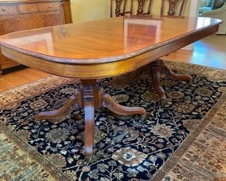 Widdicomb Georgian-style banded carved mahogany dining table $2,500 (originally $10,400)                                            30"h x 46.5"w x 77" long                                                        extends to 131" with three 18" leaves -  wear spot