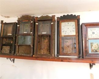 clock cases from 1800's - some have wooden works, some are levi terry & waterbury