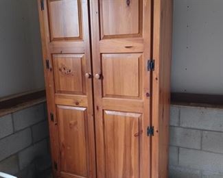 Pine wardrobe in garage 