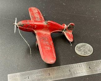 RARE because it still has the propeller, which virtually none found today have theirs. RED AIRPLANE