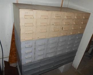 3 stacks of  metal storage drawers