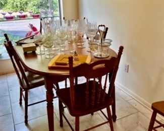 Kitchen table with 6 chairs, more wine glasses, cheese boards