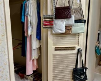 Closet with clothing shoes and purses