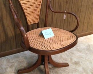 Swivel chair with cane seat