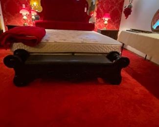 Red velvet headboard and king mattress
