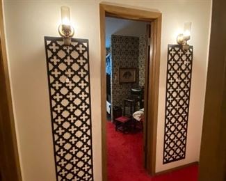 Sconces and wooden wall decor 