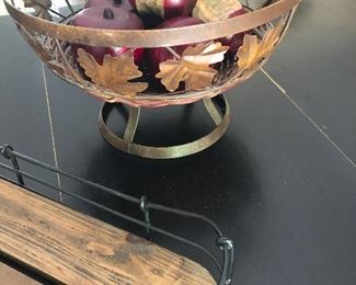 Footed metal fruit bowl