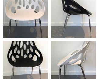 $100. Lava flow stackable chairs- two- black and white.