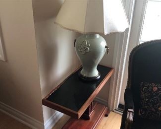 Pair of hand-crafted end tables by Chris Scharberger, 29" deep x 11.5" wide x 22" tall, $700 pr. Pair of celadon lamps with brass tassels 34" tall, $180 pr.