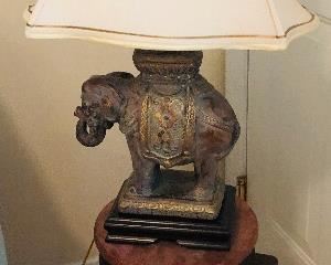 Elephant lamp $100, Stone-topped metal table $175.