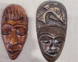 Two wooden masks 7" and 8" tall