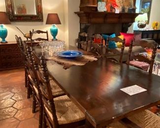 Custom 10' dining table of wood and forged iron; seats 10; designed by Mexican architect Jose Jure