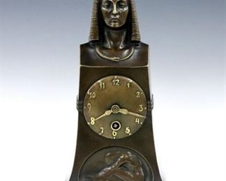 A late 19th century Lenzkirch Egyptian Revival Bronze mantle clock.  14-day time only movement with Bronze dial and Arabic numerals, serial #535705.  Cast Bronze case by "T. Bagdons" with Pharaoh bust, Asp necklace and figural lower panel.  Original patina with minor wear, running when cataloged.  10 1/2" high.  ESTIMATE $1,000-2,000