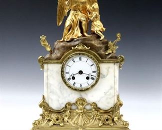 A late 19th century French Bronze mantle clock by Samuel Marti, Paris.  8-day time and strike movement with porcelain dial and Roman numerals, stamped Marti "A 1" trademark.  White Marble case with gilded bronze figure of a Guardian Angel and child, on a cast Brass base with scrollwork and floral detail.  Minor wear, running when cataloged.  18" high.  ESTIMATE $800-1,200