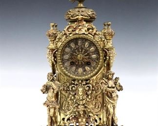 A turn of century Lenzkirch Renaissance style Brass table clock.  8-day time and strike movement with Brass dial, filigree hands and Roman numerals, serial #538820.  Cast Brass case with Owl finial over cast panels in deep relief, full bodied musicians along side a winged female figure on stepped base.  Polished case with traces of Red patination, minor wear, running when cataloged.  15 1/4" high.  ESTIMATE $600-800