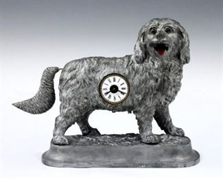 A late 19th century German Animated novelty clock by K. Mayer & Sohne.  30-hr key wind time only movement with porcelain dial and Roman numerals, stamped "Mayer" verso.  Cast Iron dog figure with glass eyes, animated tongue and wagging tail.  Old Silver paint with some wear, dial damage, runs momentarily when cataloged.  6 1/4" high.  ESTIMATE 300-400