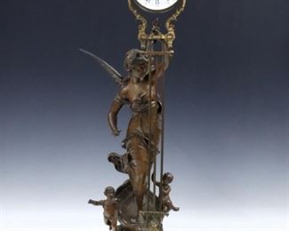A late 19th century Ansonia "Char du Progres" (Chariot of Progress) model swinging arm figural clock by André Romain Guilmet, Paris.  8-day time only movement within a Brass cannister form body with porcelain dial and Roman numerals with compensating pendulum and gilded mounts, rear plate with "G L T" trademark, serial #9067.  "Char du Progres" Spelter figure after Laroux with dark Brown patina and Marbleized turned wooded plinth.  Some wear to the original finish, running when cataloged.  24" high overall.  ESTIMATE $2,000-3,000