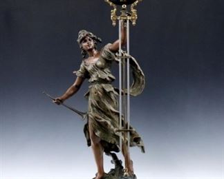 A late 19th century French "Renommee" (Fame) model swinging arm figural clock.  8-day time only movement within a painted spherical body with Roman numerals with compensating pendulum and gilded mounts.  "Renommee" Spelter figure after Auguste Moreau with two color patina and marbleized turned wooded plinth.  Some wear to the original finish, replaced nut on swing arm, running when cataloged.  34 3/4" high overall.  ESTIMATE $2,000-3,000