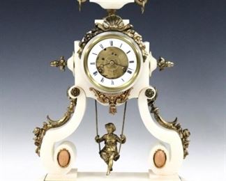 A late 19th century French "Woman on a Swing" mantle clock by Eugene Farcot.  8-day time only visible movement with porcelain chapter ring and Roman numerals has a Farcot patent swinger escapement with double escape wheel, and cast pendulum with figure, movement signed, "Chappement Brevete" with Eagle Trademark, serial #63506.  Alabaster case with scrolled supports, urn finial with gilded Brass arms, finials and appliques, painted bosses and lower panel, on scrolled feet.  Some wear and edge chips to case, dial hairlines, running when cataloged.  18 3/4" high.  ESTIMATE $1,500-2,500