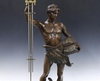 A 20th century French "Genie Createur" (Creative Genius) model swinging arm figural clock.  8-day time only movement within a painted spherical body with Roman numerals with compensating pendulum and gilded mounts.  Spelter figure entitled "Genie Createur" after H. Eugery with medium Brown patina.  Minor wear, running when cataloged.  43" high overall.  ESTIMATE $1,000-2,000