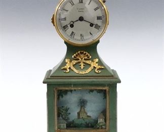 An early 20th century mantle clock with musical automaton by Harold Carter-Bowles, Cheltenham, England 1889-1961.  8-day time and strike movement with "Gautier" balance wheel escapement and Silvered dial with Roman numerals by Silvani, Paris.  Painted wooden case with Brass head and Owl finial, lower windmill automaton with river boats on a canal and cylinder music box inside the case winds independently to power the music box and automaton which plays at 6:00, 9:00 and 12:00, repeats on demand.  Paper label "Carter Bowles...Cheltenham" under base.  Some paint and dial wear, running when cataloged, automaton and music box working.  16 1/4" high.  ESTIMATE $1,000-2,000