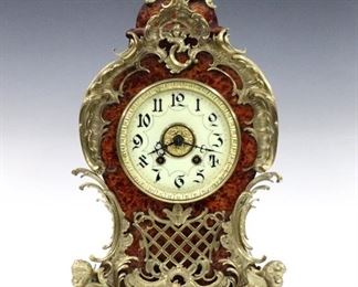 A late 19th century Lenzkirch Louis XV style table clock.  8-day time and strike movement with porcelain dial and  Arabic numerals, serial #782963.  Shaped case with original faux tortoise shell finish  case with cast Bronze finial, dial surround, lower grill and scrolled cherub feet.  Some wear, craquelure and loss to finish, running when cataloged.  20 1/2" high.  ESTIMATE $1,000-1,500