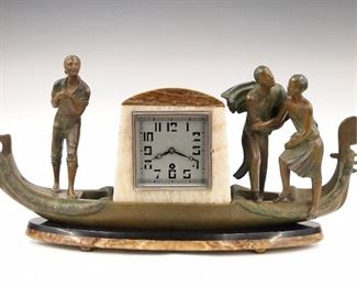A 1930's French Art Deco Period mantle clock with figures in a gondola by Marti.  30 hour time only movement with balance wheel escapement, Silvered dial with Arabic numerals.  Multi color Marble/Slate case with patinated Spelter gondola and figures.  Some wear, running when cataloged.  20" long x 10" high.  ESTIMATE $200-300