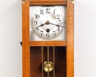 An early 20th century Junghans Miniature wall clock.  3-day time only spring driven movement with a 4" square Silvered dial and Arabic numerals.  Mixed wood case with shaped crest and Brass wreath, single door with dial and lower glasses, attached shaped drop.  Old finish with minor wear, running when cataloged.  13" high overall.  ESTIMATE $300-400
